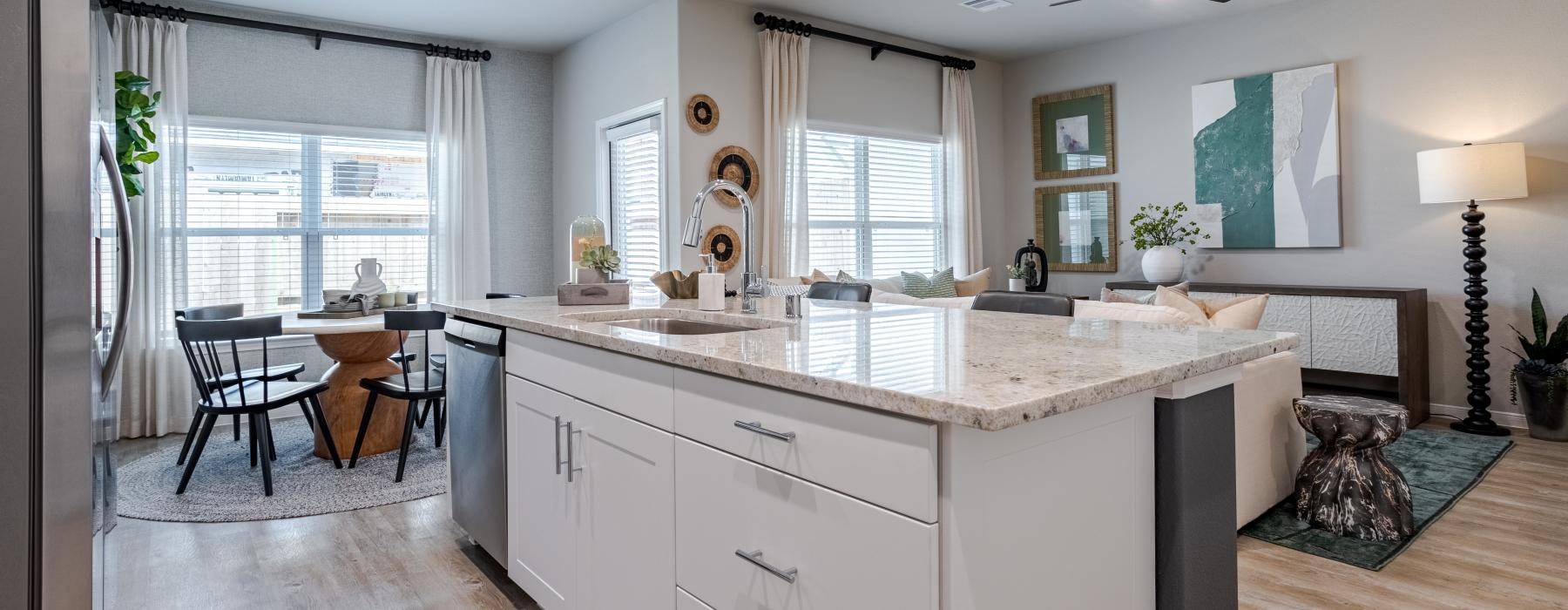 a kitchen with white cabinets